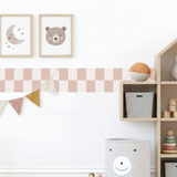 Children's room with wooden shelves, toys, and wall decorations.